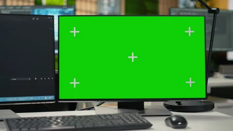 Green screen PCs on office desk used to implement machine learning Stock Footage 323143160