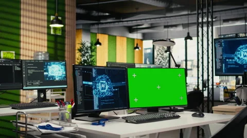 Green screen PCs on office desk used to implement machine learning Stock Footage 323238390