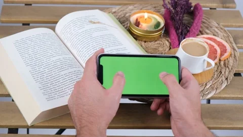 Green screen phone and coffee playing game Vídeo Stock 236385435