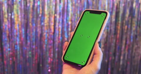 Green screen phone mockup with tracking markers. Hands holding the chroma key Stock Footage 150209643
