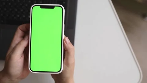 Green screen phone n hands above the keyboard Stock Footage 244707237