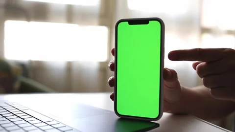Green screen phone n hands above the keyboard Stock Footage 244707240