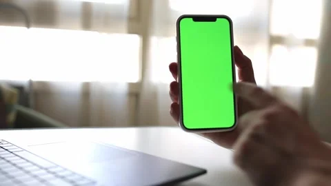 Green screen phone n hands above the keyboard, phone chroma Stock Footage 246037245