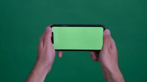 Green screen phone playing game Stock Footage 236372762