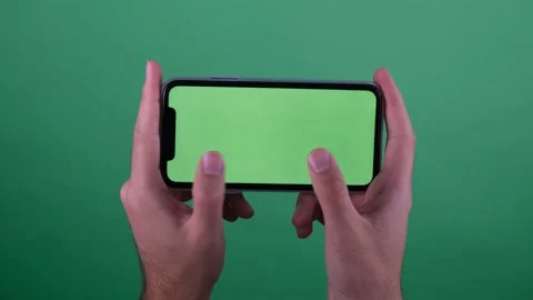 Green screen phone playing game Stock Footage 236374986