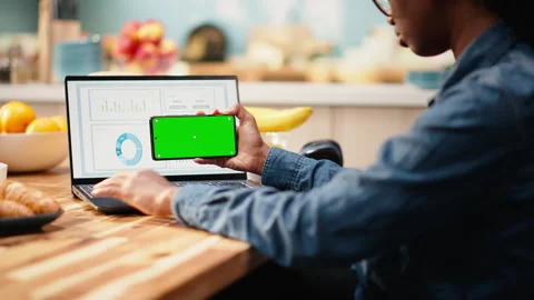 Green screen on phone with professional working remotely Stock Footage 344248353