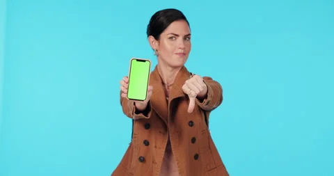 Green screen phone, thumbs down and woman point at bad mockup design, brand fail Stock Footage 245195855