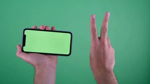 Green screen phone two finger Video stock 236375129