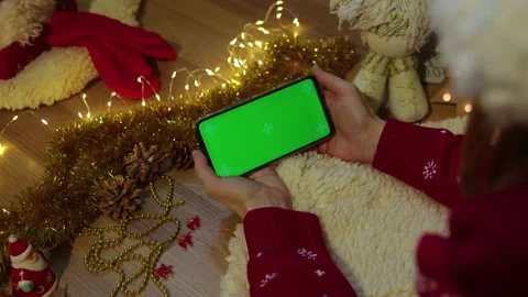 Green screen pnone in hands. Christmas concept Stock Footage 166973768
