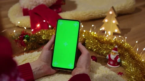 Green screen pnone in hands. Close up. Christmas concept Video stock 166120254