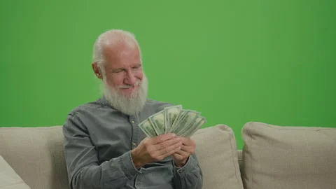 Green Screen. A Rich Old Man Counting His Money in US Dollars. Stock Footage 263396377
