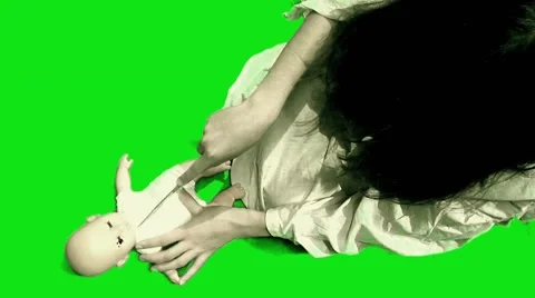 Green screen sequence dead girl cutting girl doll Stock Footage 59830092