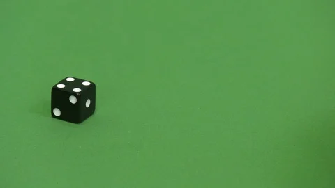 Green screen shot of a black dice rolling 4 動画素材 117989525