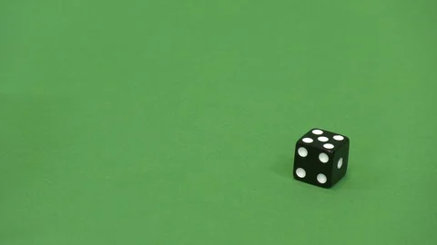 Green screen shot of a black dice rolling 5 動画素材 117989595