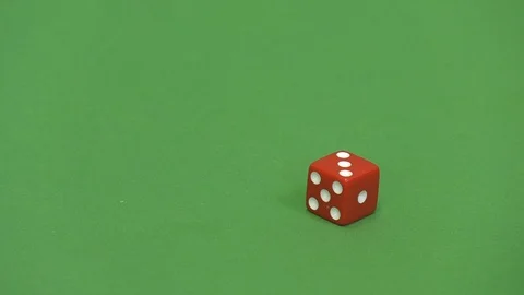 Green screen shot of a red dice rolling 3 Stock Footage 117992171