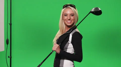 Green screen shot of a woman golfer Stock Footage