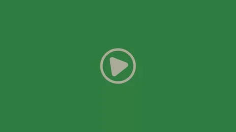 A green screen with small white dot on it and button play an arrow pointing to Видео 335130558