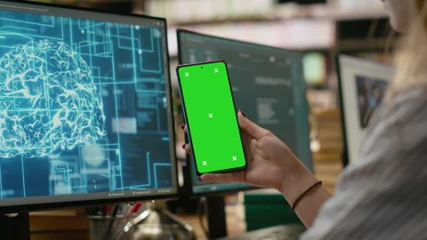 Green screen on smartphone with AI neural network on computer monitor Stock Footage 337231579