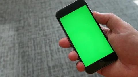 Green screen on smartphone face. Stockbeeldmateriaal 112852509