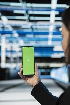 Green screen smartphone, gear optimization and technician in server farm Stock Photos
