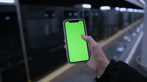 Green screen on the smartphone. Metro background Stock Footage 221544996