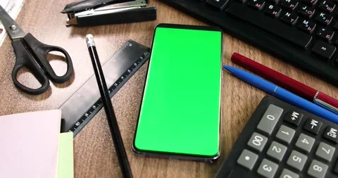 Green screen smartphone on the office table Stock Footage 134075256