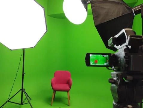 A green screen studio with complete equipment, With a red chair. Stock Photos