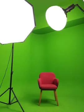 A green screen studio with complete lighting equipment. With a red chair. Stock Photos