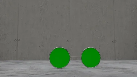 Green screen sun glasses laying on concrete floor Stock Footage 87354589