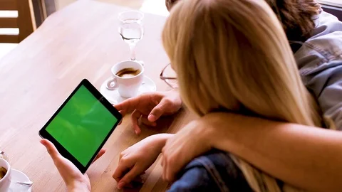 Green screen on tablet device, Young couple watching together - Mock up Stock Footage 89827856