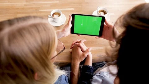 Green screen on tablet device, Young couple watching together - Mock up Stock Footage 89828331