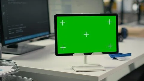 Green screen tablet in empty startup office with artificial intelligence Stockfoto's