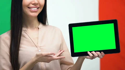 Green screen tablet in female hand against Italian flag, traveling app, emigrant Stock Footage 110687589
