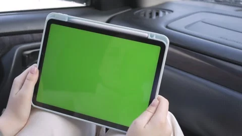 Green screen tablet held by person in car Stock Footage 343850840