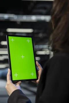 Green screen tablet, infrastructure rig troubleshooting and admin in data center Stock Photos
