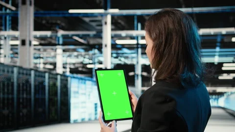 Green screen tablet, optimizing servers and admin in data center Stock Footage 329325097