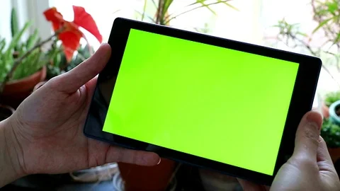 Green screen on tablet with scrolling thumb Stock Footage