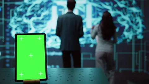 Green screen tablet used by computer scientists in AI startup Stock Footage 278695432