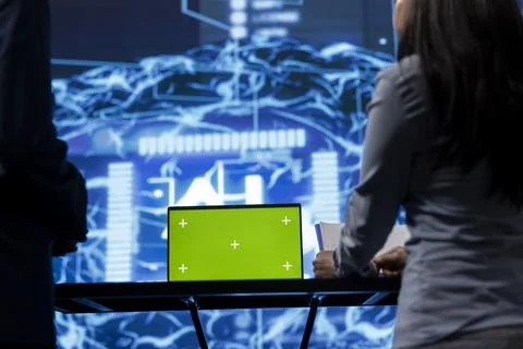Green screen tablet used by computer scientists in AI startup, close up Foto stock