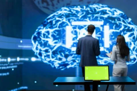 Green screen tablet used by computer scientists working in AI startup Stock Photos