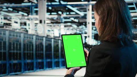 Green screen tablet used by data center admin to optimize server load balancing Video stock 328333841