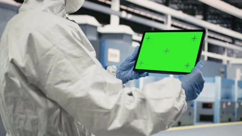 Green screen tablet used by microchip factory professional testing silicon wafer Stock Footage 333391722