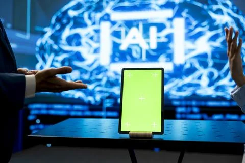 Green screen tablet used by team of programmers working on deep learning tech Stock Photos