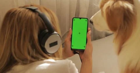 GREEN SCREEN tracking dot. Portrait of Pretty girl young women in headphones Stock Footage 233662557