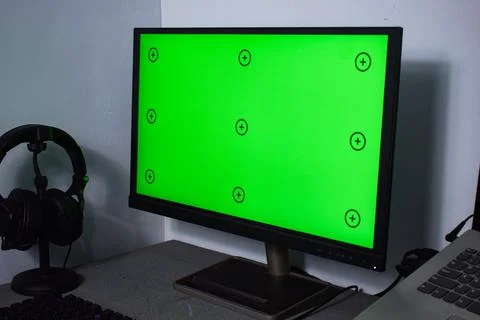 Green screen with tracking, graphic designer set up working on table Stock Photos
