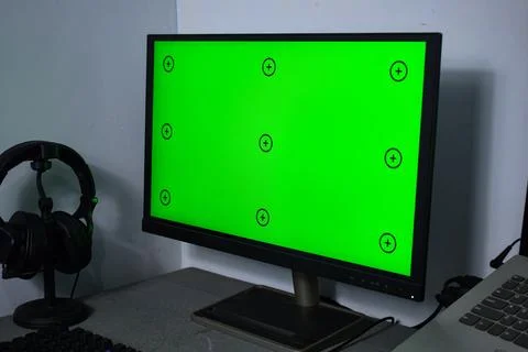 Green screen with tracking, graphic designer set up working on table Stock Photos