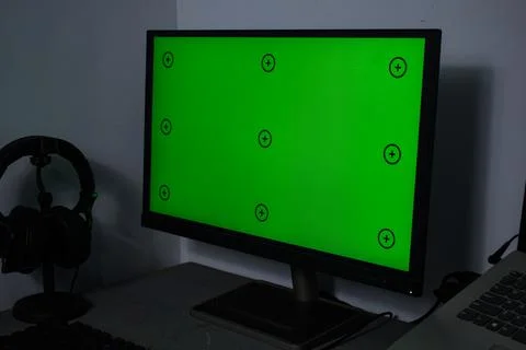 Green screen with tracking, graphic designer set up working on table Stock Photos
