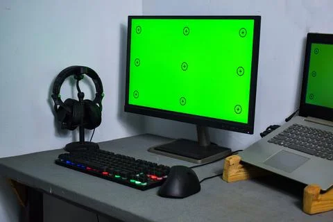 Green screen with tracking, graphic designer set up working on table Stock Photos