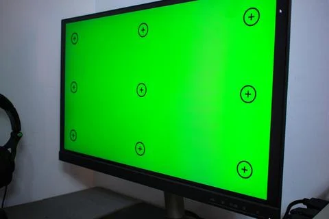 Green screen with tracking, graphic designer set up working on table Stock Photos