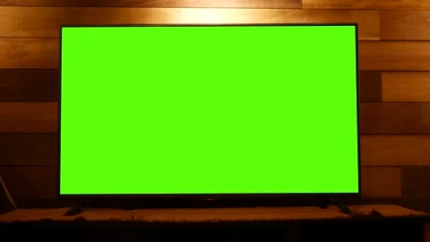 Green Screen TV in front of Rustic Feature Wall in Finished Basement Stock Footage 324684874